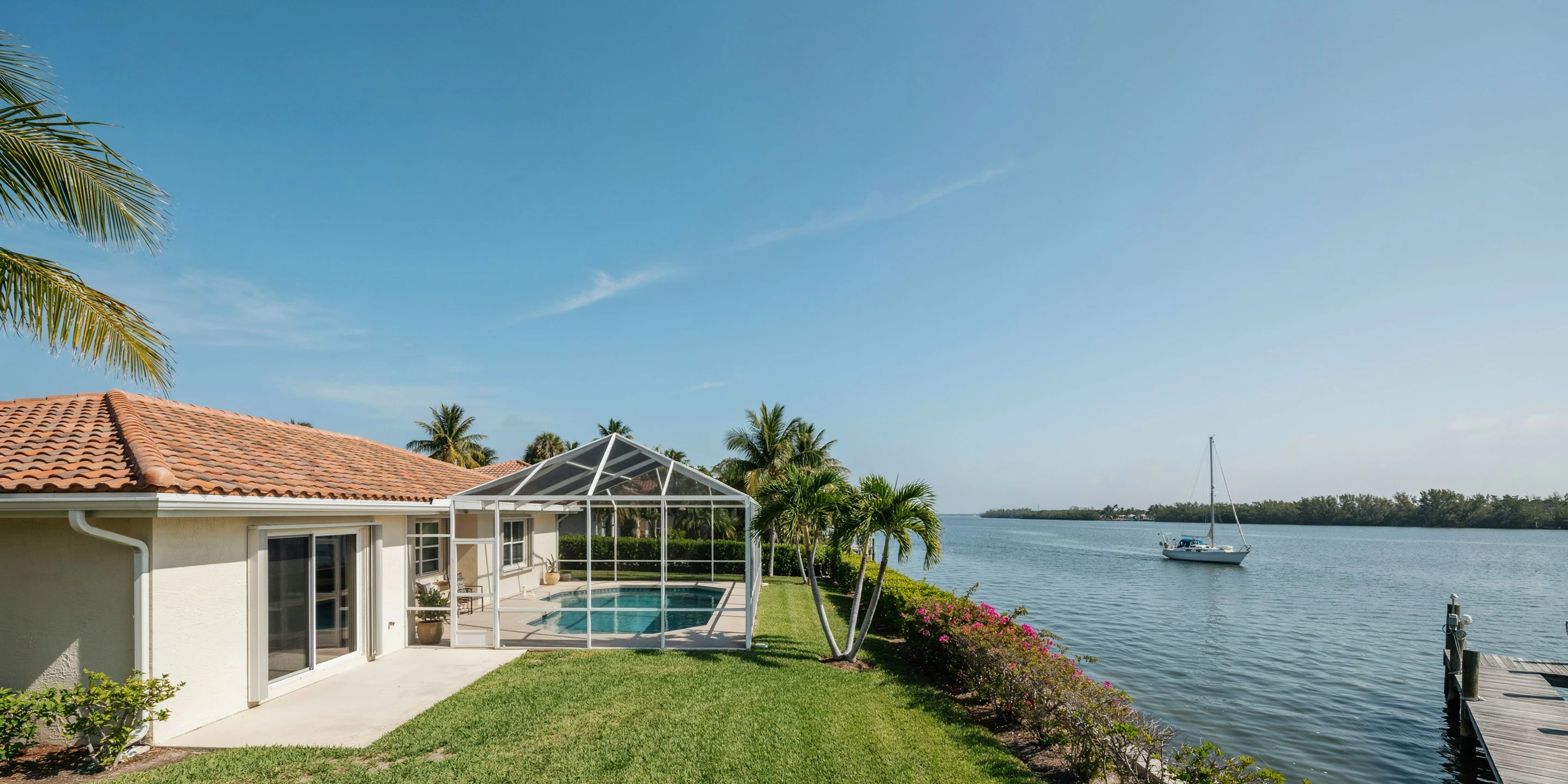Bayfront ranch home with pool cage in Palmetto, FL